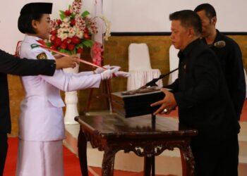 Wawali Kotamobagu Pimpin Upacara Pemindahan Duplikat Bendara Merah Putih