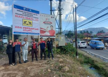 PT. Jasa Raharja Kotamobagu Lakukan Pemasangan Spanduk Keselamatan di Moyongkota