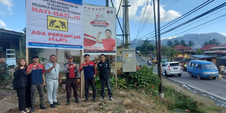 PT. Jasa Raharja Kotamobagu Lakukan Pemasangan Spanduk Keselamatan di Moyongkota